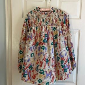 Size M EUC JODIFL Pullover long sleeved blouse with back neck button closure.